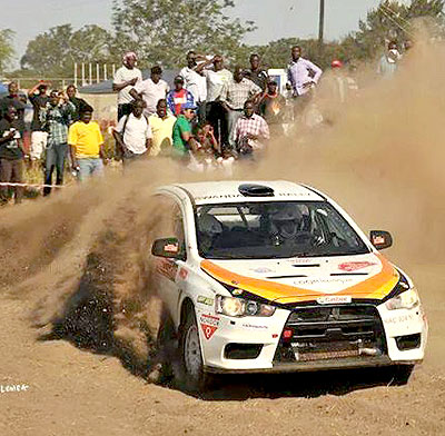 Rwanda's Davite Giancarlo and Sylvia Vindevogel cruise their Mistubishi Evo 10 in the Zambia international rally held on May 16-18 in Lusaka. Courtesy