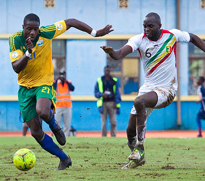 Rwanda's defender Edwin Ouon, left, wheels off as Mali's Muhamed Sissoko chases during a 2014 World Cup qualifier at Amahoro stadium. File.