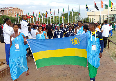 Belysee Irakoze, left and James Sugira, right, lead Team Rwanda at the opening ceremony held at the National Stadium of Botswana in Gaborone.  Bonnie Mugabe