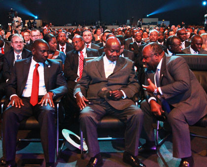 Ugandan President Yoweri Museveni (C) listens to Gabonese President Ali Ben Bongo Ondimba as Kenyau2019s Deputy President William Ruto looks on during an AfDB session on Thursday. John Mbanda.