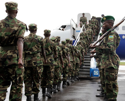RDF soldiers leave Kigali for a peace keeping mission to Darfur in 2012.  File. 