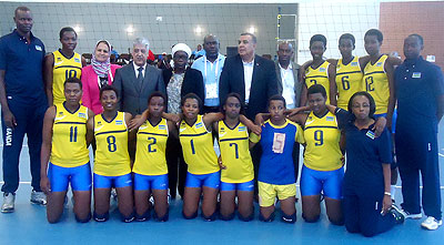 Rwanda U18 girls' team pose with CAVB officials before their game against South Africa. B. Mugabe