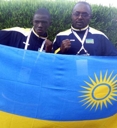 Jean Pierre Cyiza, left and his trainer  Gashugi Kananura after winning a bronze medal for Rwanda on Monday in Gaborone. B. Mugabe
