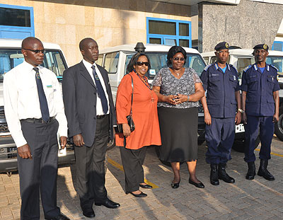 L-R: Warsame, minister Mukantabana, DGIP Nsabimana and  police spokesperson Demas Gatare during the handover  of the vehicles.  Richard Mugarura.