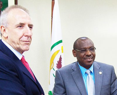 Finance minister Amb. Claver Gatete(R)together with  Mike Hammond,  the outgoing DFID boss in Rwanda. File photo.