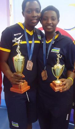 Seraphine Mukantambara (L) and Olive Mutamba pose with their African championship awards yesterday in Molepolole. B. Mugabe