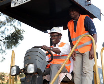 City of Kigali mayor Fidele Ndayisaba (L) launches the construction of city suburb roads yesterday.  John Mbanda.