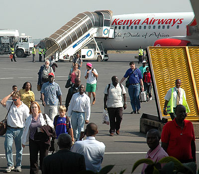 Passengers arrive at Kigali International Airport. A proposal is in place to levy tax on air tickets purchased from all airlines in the five countries of the East African Community. File. 