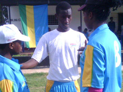 Coach Eric Ndangamyambi giving playing tips to the national team openers, Sarah Uwera and Egidia Uwimana in a recent game. (Courtesy)