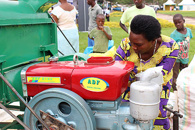 Devota Nsabamariya from Nyagatare District exhibits her maize grinding machine. The machine has a capacity of grinding 25 tonnes of maize in one day and costs Rwf 2 million.
