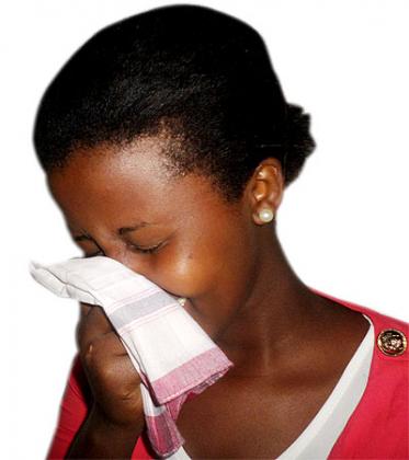 A woman clears her respiratory system. Doctors urge timely treatment of sinuses. Solomon Asaba.