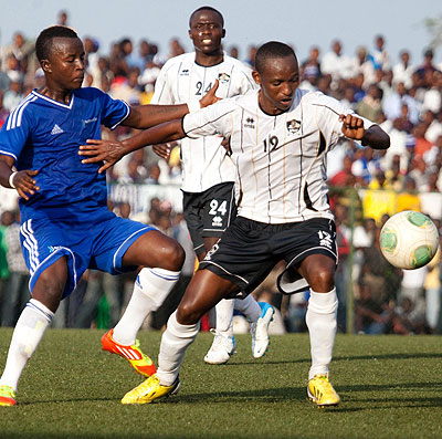 Jean Claude Iranzi shields the ball from Rayonu2019s Robert Ndatimana. The lethal midfielder has shaken off an ankle injury ahead of todayu2019s tie against SC Kiyovu. T. Kisambira