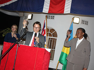 The British High Commissioner, his wife and (R) Amb. Jeanine Kambanda, Permanent Secretary, Minaffet make a toast. (Courtesy)