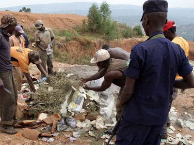 A Policeman on guard as illicit drugs are destroyed in Nduba, Gasabo District last week. (John Mbanda)