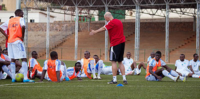 Rwanda national team players listen to their coach Stephen Constantine during a training session ahead of the Afcon qualifier against Libya. T. Kisambira.