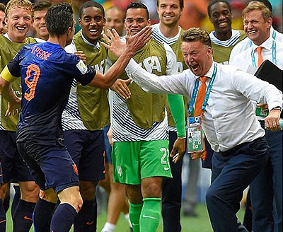  Happy Holland: Louis van Gaal high fives Van Persie after the forward's brilliant equaliser