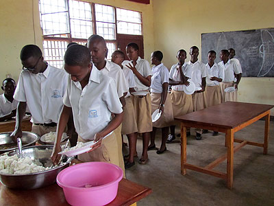 Students of GS Camp Kanombe serve themselves food last week. Jean de la Croix Tabaro.
