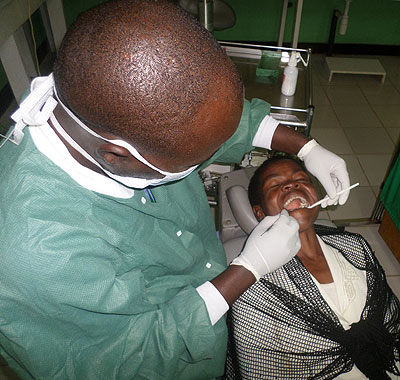 A dental therapist at Kibogora works on a patient. Ivan Ngoboka. 