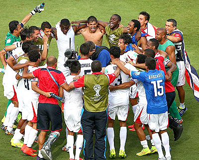 Circle of life: Costa Rica celebrate their 1-0 victory over Italy which sends them through to the last 16.  Net photo