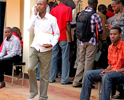 Residents of Kicukiro wait to be cleared by Noteries. File. 