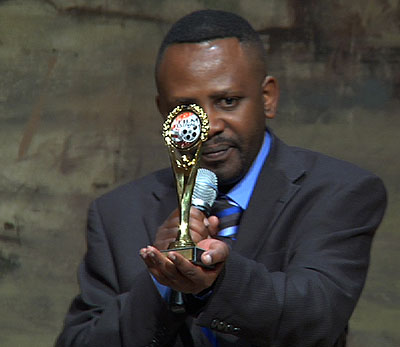 Ndahayo recieves an award at the second annual Silicon Valley African Film Festival, for Beyond The Deadly Pit.