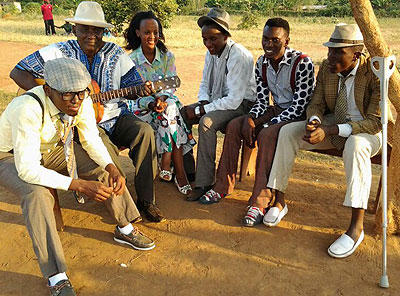 Kina Music artistes with Makanyaga Abdul (2 R) on a set of Nshatse Incuti.