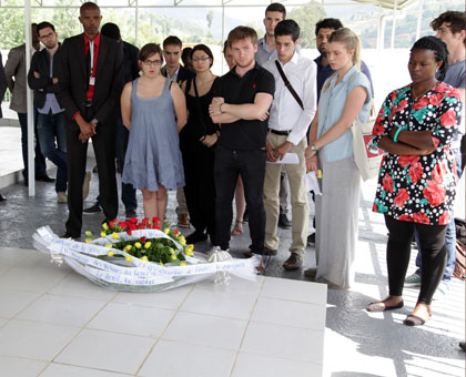 The visiting youth pay tribute to Genocide victims interred at Murambi memorial site yesterday. John Mbanda.