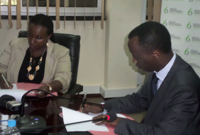 Kayonga (right) and Kanyankole sign the MOU. The funds from FONERWA will support green growth. Photo: Asaba Solomon   