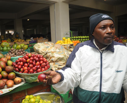 Vedaste Semutwa, a fruit  vendor at City Market. WB is seeking to alleviate poverty through their support. T. Kisambira. 