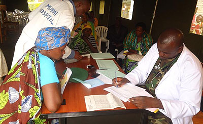 An RDF doctor attends to a patient on May 14, 2012 at Munini Hospital in Nyaruguru during the official launch of the drive. File.