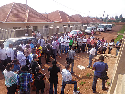 Some of the potential home buyers who participated in the KCB property bus tour listen to bank officials at one of they estates the visited. The bank looks to ease access to mortgages for salaried individuals.  The New Times / Athan Tashobya.