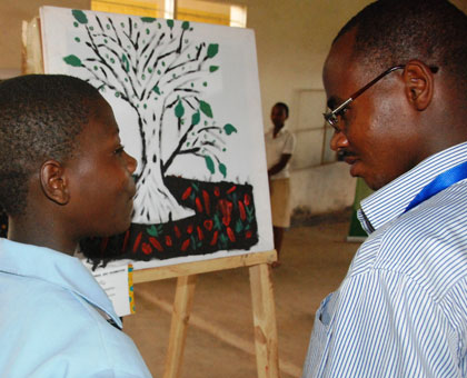 A student explains her art piece. (Courtesy)