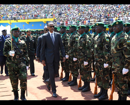 President Kagame inspects a Guard of Honour mounted by the Rwanda Defence Forces at Amahoro Stadium yesterday. Village Urugwiro. 