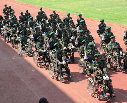 Down but not out: Physically impaired soldiers mount a guard of honour during the 20th Liberation Anniversary on Friday. (John Mbanda)