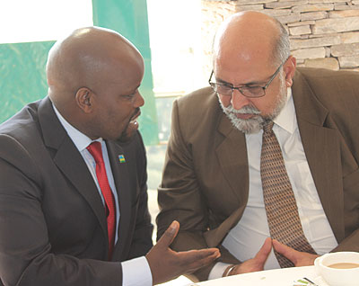 Youth and ICT Minister Nsengimana (left) chats with Airtel Rwanda boss Bhullar at the meeting. Courtesy.  