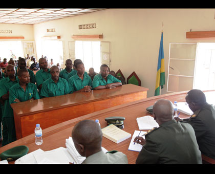 Mutabazi (left front row) and co-accused appear before the court during a past hearing. File.