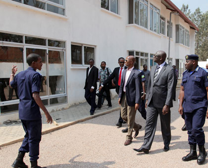 IGP Gasana (R) and Ministers Busingye (2nd right) and Harelimana tour the facility yesterday. (John Mbanda)