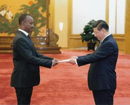 Amb. Chharles Kayonga presents credentials to President Xi Jinping. (Paul Ntambara)