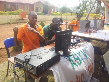 Exhibition: Mutimana Joel, 20, of Agahozo Shalom operating a self-made village radio.  Photo by Edwin Musoni