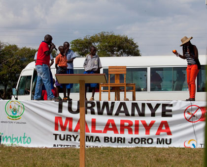 Artistes dramatise a performance during a malaria campaign in the countryside. Timothy Kisambira. 