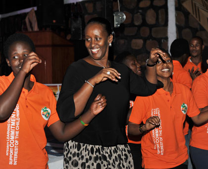 First Lady Jeannette Kagame shares a light moment with Agahozo Shalom children. (Courtesy)