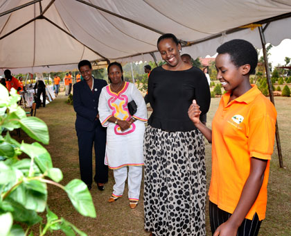 The First Lady listens to a student at Agahozo-Shalom Youth Village in Rwamagana on Thursday. She was accompanied by the Minister for Gender and Family Promotion, Oda Gasinzigwa (L), and the Governor, Eastern Province, Odette Uwamariya. Courtesy.   