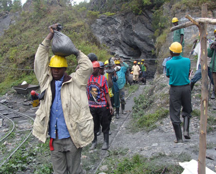 Miners of Gifurwe Wolfram Company in Burera District carry minerals out of a tunnel. File.  