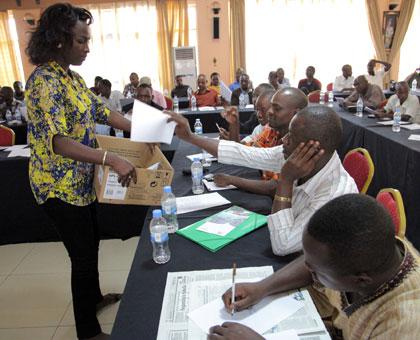 A member of the election committee collects ballot papers during the ARJ elections yesterday. (John Mbanda)