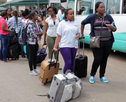 Diaspora students leave Amahoro Stadium for the two-week civic education programme in Gabiro yesterday.John Mbanda.
