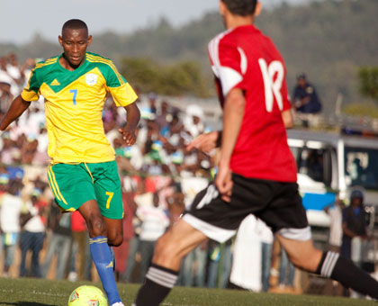 Jean-Baptiste Mugiraneza (L), seen against Libya in the past qualifier, will be Amavubiu2019s key player in the midfield when Rwanda takes on Congo away in Pointe-Noire on Sunday. (Timothy Kisambira)