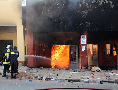 Firefighters try to contain a blaze at Quartier Mateus last week. John Mbanda.