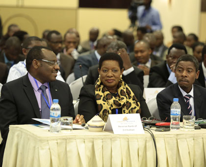 Finance minister Claver Gatete (L) and other dignitaries at the Financial Inclusion for Inclusive Growth and Sustainable Development Summit in Kigali yesterday. John Mbanda.