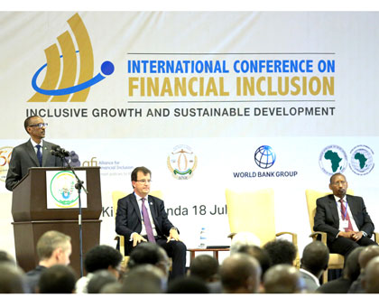 President Kagame addresses the Financial Inclusion summit in Kigali yesterday. Looking on are the World Bank Group Chief Financial Officer, Bertrand Badru00e9 (centre), and the Governor,  National Bank  of Rwanda, John Rwangombwa. Village Urugwiro.