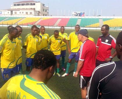 Amavubi head coach Stephen Constantine gives tips to his players before taking them in yesterdayu2019s evening drills in preparation for todayu2019s crunch qualifier in Pointe-Noire. (Courtesy)